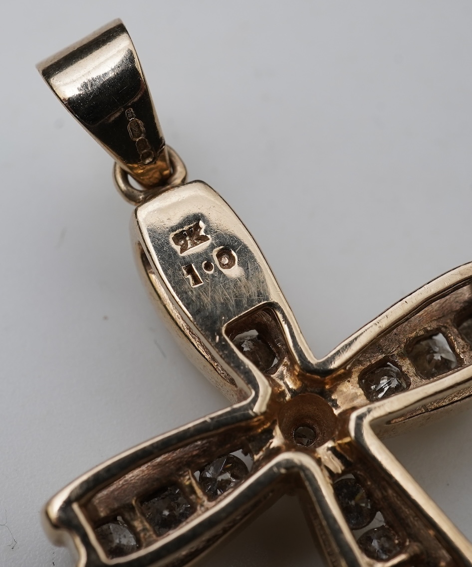 A diamond cross pendant